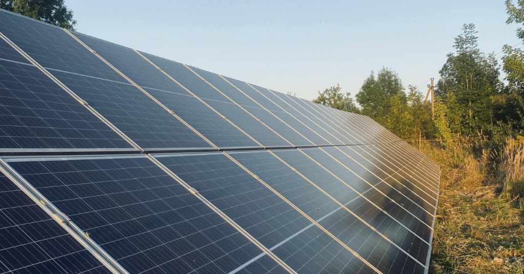 A sleek home battery storage unit installed in a garage, showing how to maximize energy independence and avoid future tariffs.