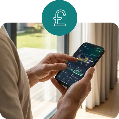 A close-up of a man's hands using a smartphone to check energy cost savings on the Hanchu ESS app, indicated by a British Pound Sterling (£) icon overhead.